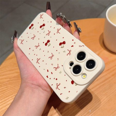 A Vintage-Style White Polka Dot Bow And Cherry TPU Shock-Resistant Case That Offers Complete Protection, Specifically Made for Apple Iphone Models 6 Through 16 Pro Max.